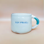 Load image into Gallery viewer, Taza Soy Feliz - ojito y boqui azuli
