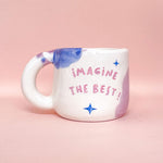 Load image into Gallery viewer, Taza con asa - IMAGINE THE BEST!- ojitos y corazón
